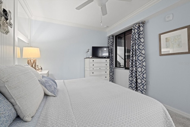 bedroom featuring carpet flooring, ceiling fan, and crown molding