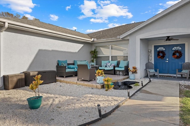 exterior space with ceiling fan, a patio, outdoor lounge area, and stucco siding