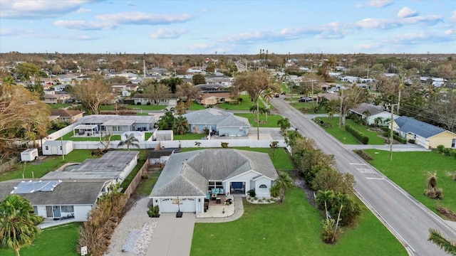 birds eye view of property with a residential view