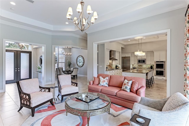 living room with french doors, a notable chandelier, crown molding, and light tile patterned flooring