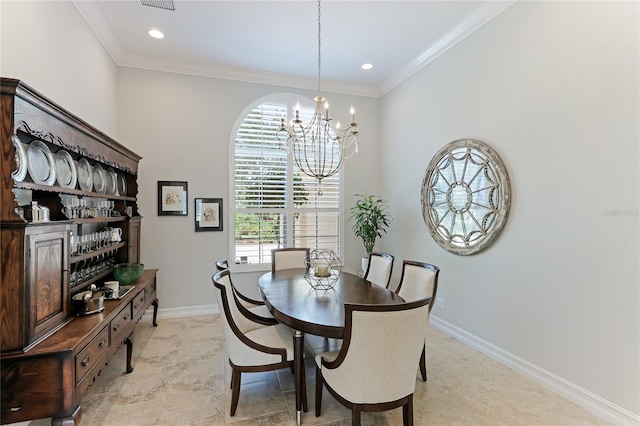 dining room featuring ornamental molding and an inviting chandelier