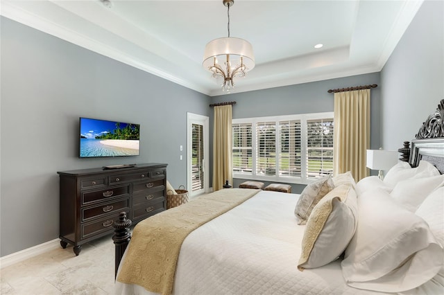 bedroom featuring a raised ceiling, ornamental molding, and a chandelier