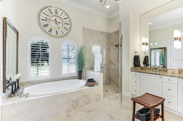 bathroom with ornamental molding, shower with separate bathtub, and vanity