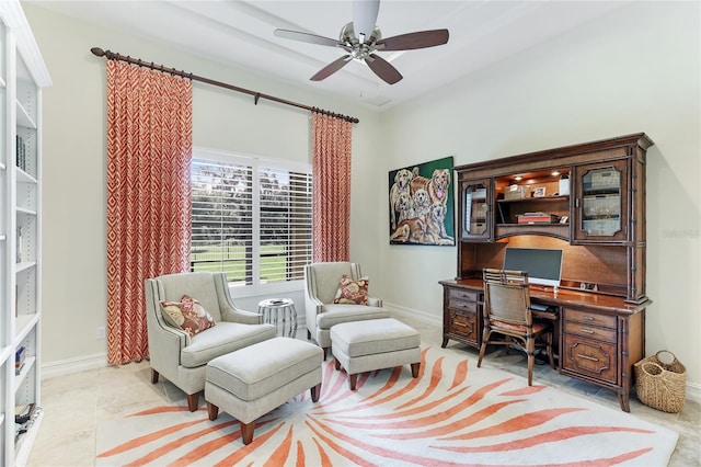 tiled home office featuring ceiling fan