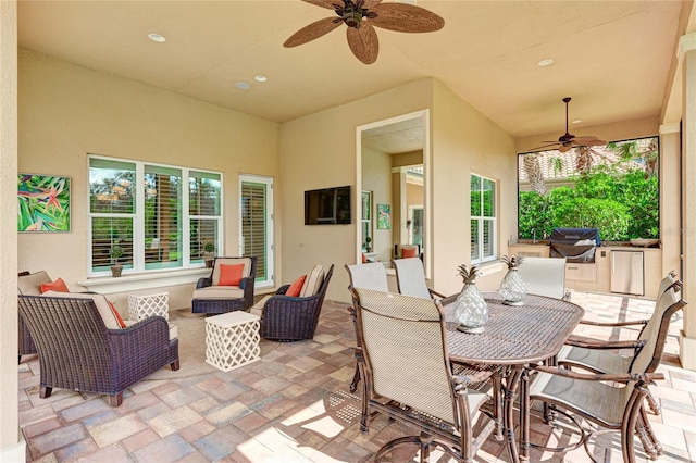 view of patio / terrace with ceiling fan, grilling area, and an outdoor living space