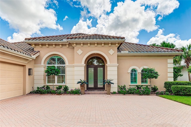 view of front of house featuring french doors and a garage