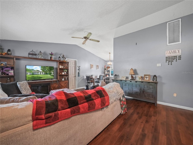 5337 Jacob Ave, Polk City, FL 33868 - living area featuring dark wood-type flooring, a ceiling fan, visible vents, vaulted ceiling, and baseboards