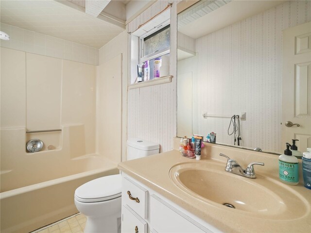 full bathroom with washtub / shower combination, vanity, and toilet