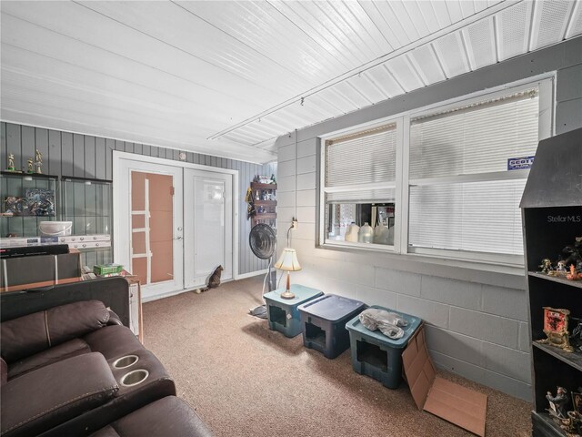 living room with french doors and carpet flooring