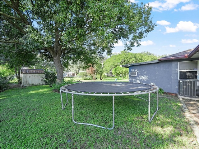 5337 Jacob Ave, Polk City, FL 33868 - view of yard with central AC and a trampoline