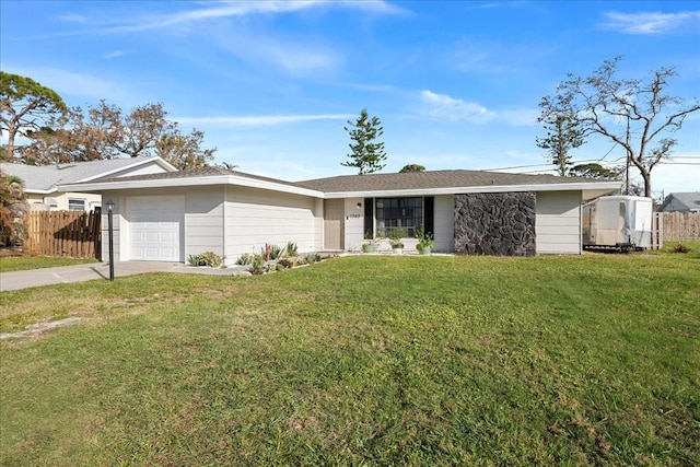 ranch-style house featuring a garage and a front yard