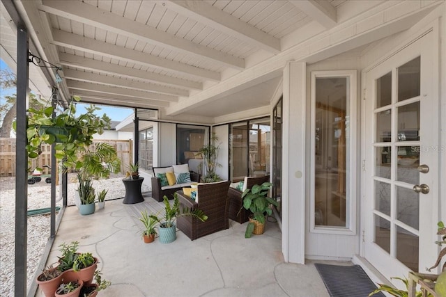 sunroom with beam ceiling