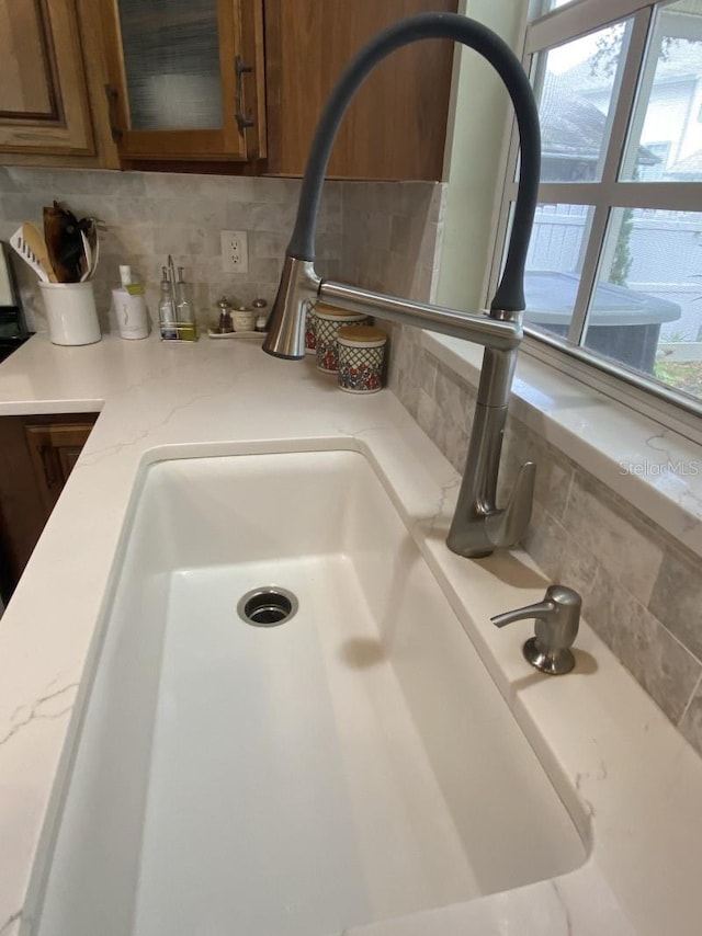 room details with decorative backsplash and sink