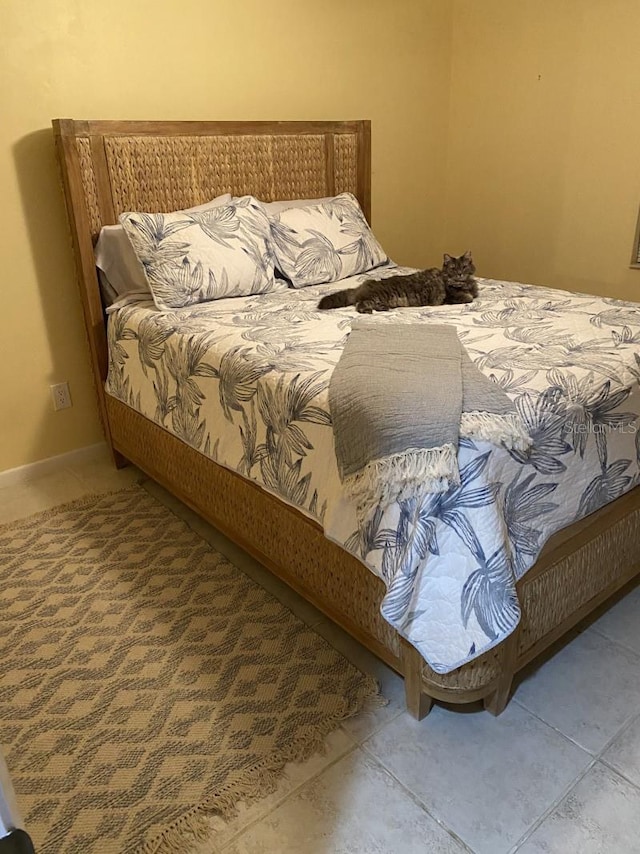 bedroom featuring tile patterned floors