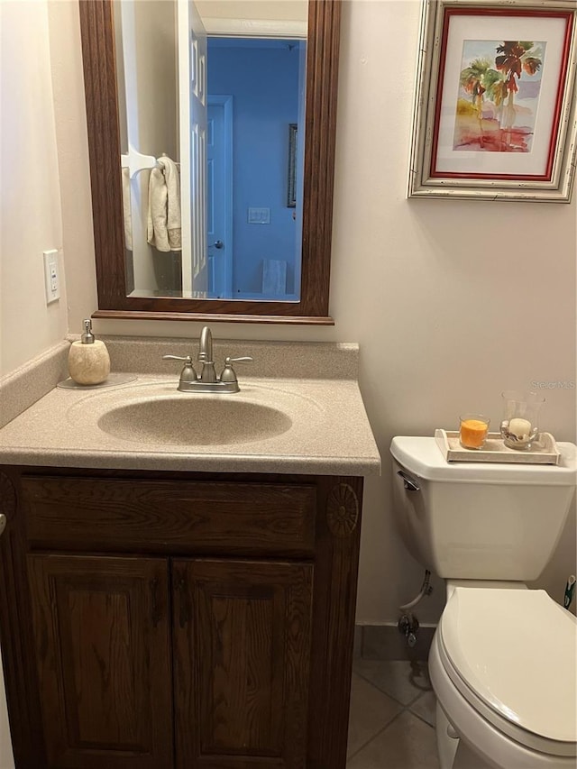 20 Bristol Ln, Palm Coast, FL 32137 - half bathroom with vanity, toilet, and tile patterned floors