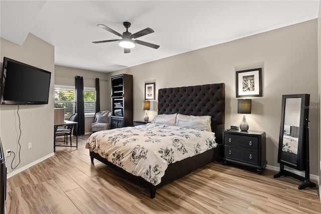 bedroom with ceiling fan and light wood-type flooring