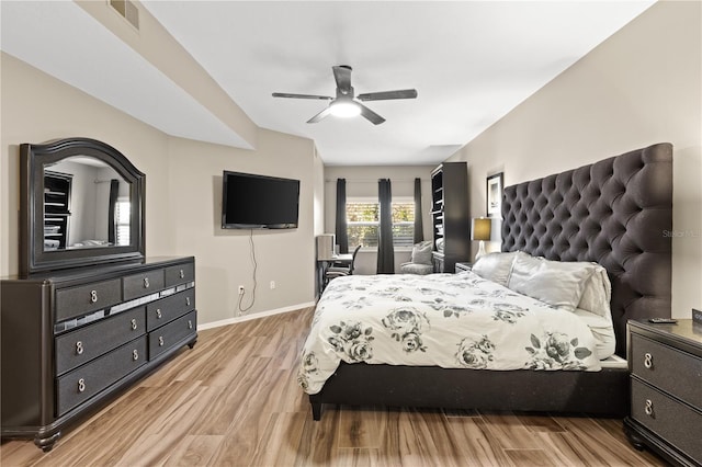 bedroom featuring light wood-type flooring and ceiling fan