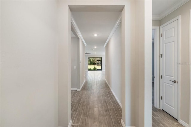 corridor featuring light hardwood / wood-style floors and ornamental molding