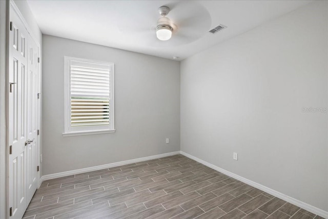 unfurnished room with light wood-type flooring and ceiling fan