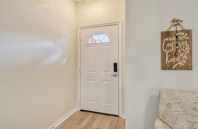 doorway with light wood-type flooring