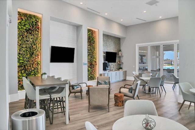 living room with light hardwood / wood-style flooring