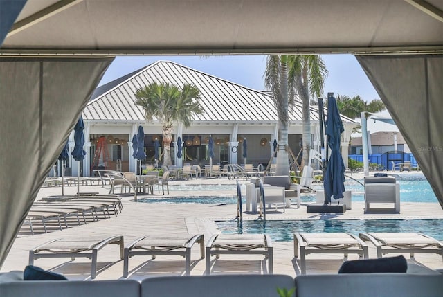 view of swimming pool with a patio