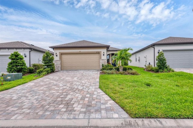 view of front of house with a front yard and a garage