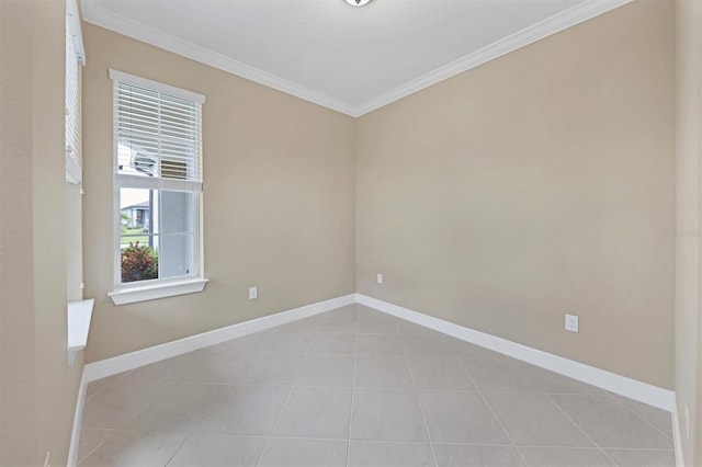 tiled empty room featuring ornamental molding