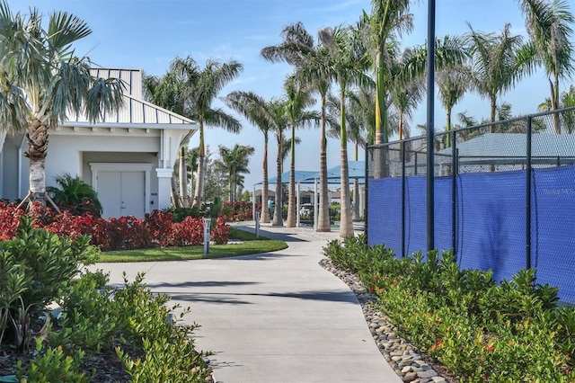 view of property's community with tennis court