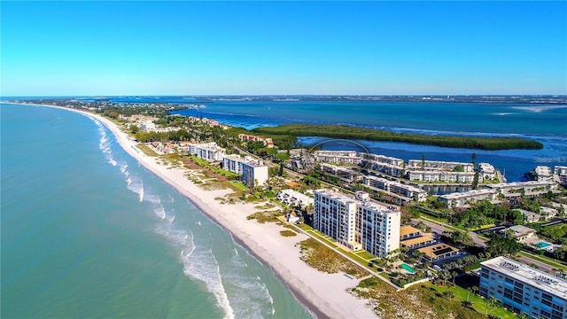 aerial view with a water view and a beach view