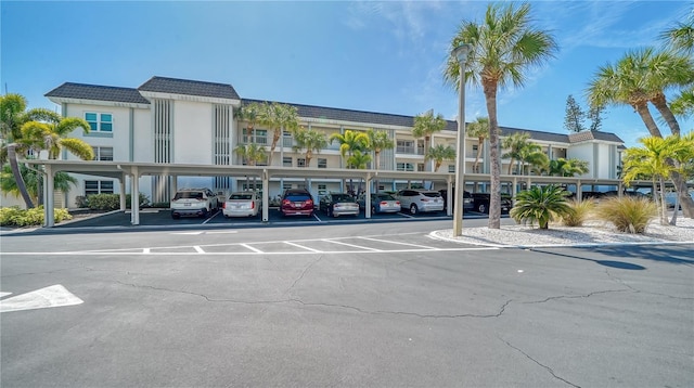 4380 Exeter Dr Unit 303, Longboat Key, FL 34228 - view of building exterior featuring covered parking