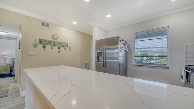 kitchen featuring crown molding, light hardwood / wood-style flooring, stainless steel fridge with ice dispenser, light stone counters, and stove