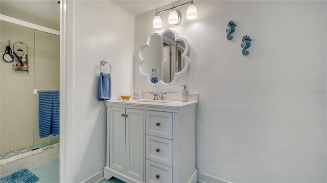 4380 Exeter Dr Unit 303, Longboat Key, FL 34228 - bathroom with vanity, a stall shower, and baseboards