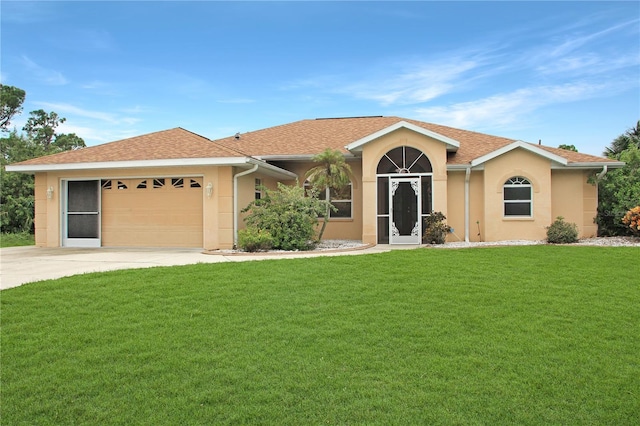 ranch-style house featuring a front yard and a garage