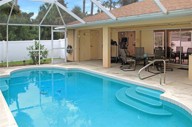 view of pool featuring a lanai and a patio area