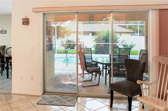 doorway with plenty of natural light and light tile patterned floors