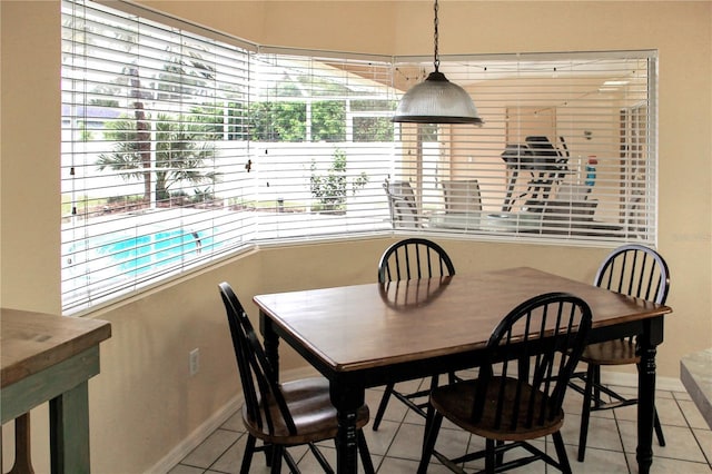 dining room featuring a wealth of natural light and light tile patterned flooring