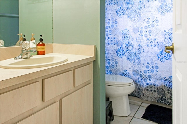 bathroom with tile patterned floors, vanity, and toilet