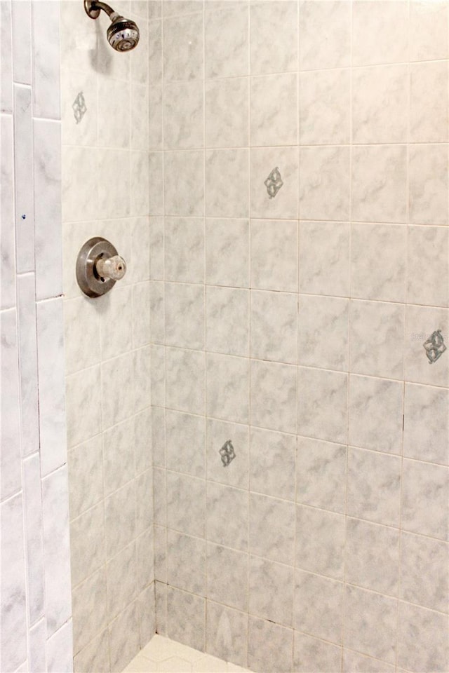 bathroom with a tile shower