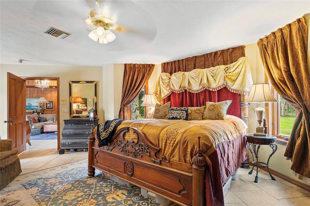 bedroom featuring ceiling fan and light tile patterned floors