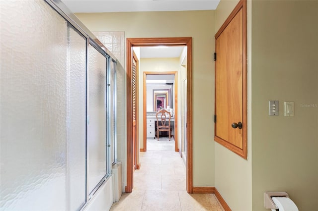 corridor with light tile patterned flooring