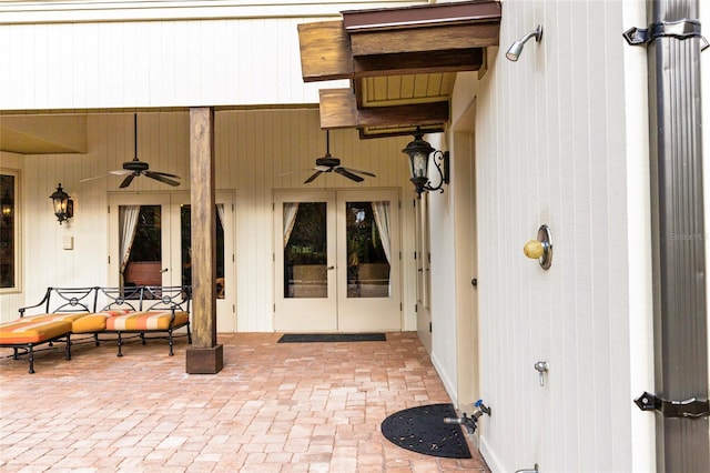 property entrance with a patio area, ceiling fan, and french doors