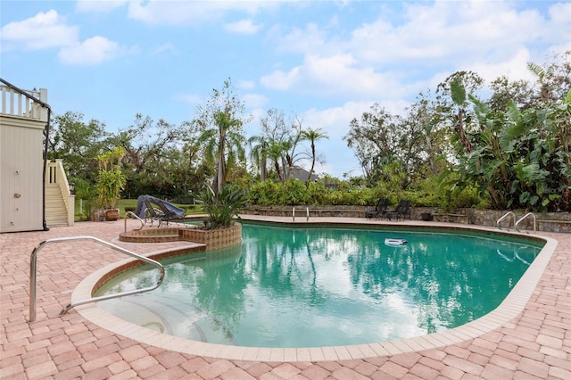 view of pool featuring a patio