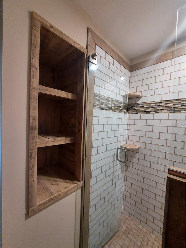 bathroom featuring an enclosed shower