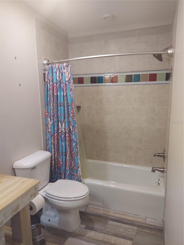 bathroom with shower / tub combo and toilet