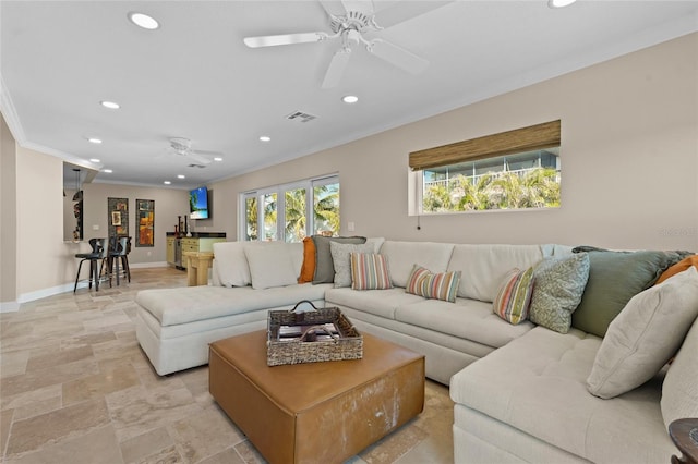 living room with crown molding and ceiling fan