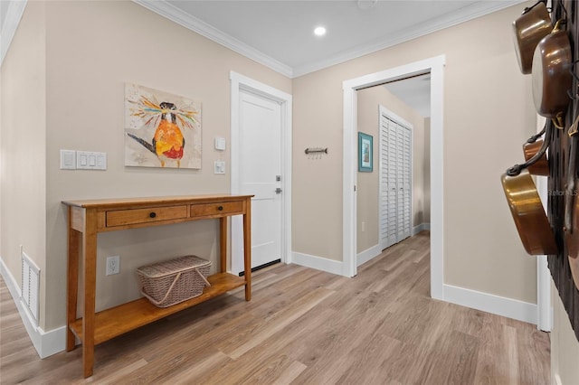 corridor featuring light hardwood / wood-style flooring and ornamental molding