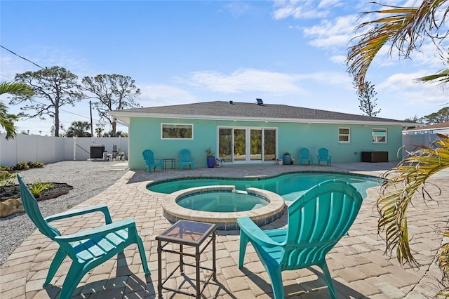 view of swimming pool with an in ground hot tub and a patio