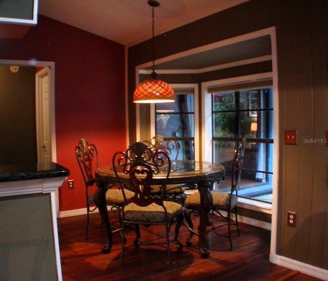 dining area with dark hardwood / wood-style flooring