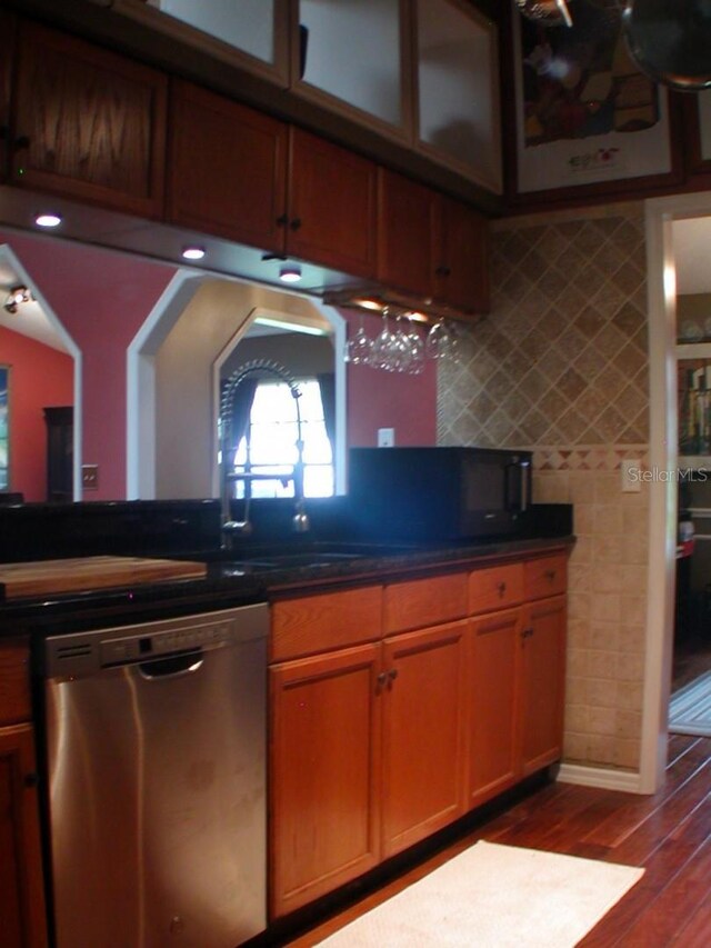 kitchen with dishwasher and dark hardwood / wood-style floors